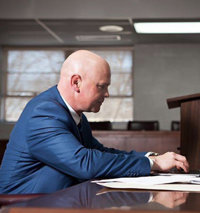 Attorney Marcus A. Lipham working at a desk